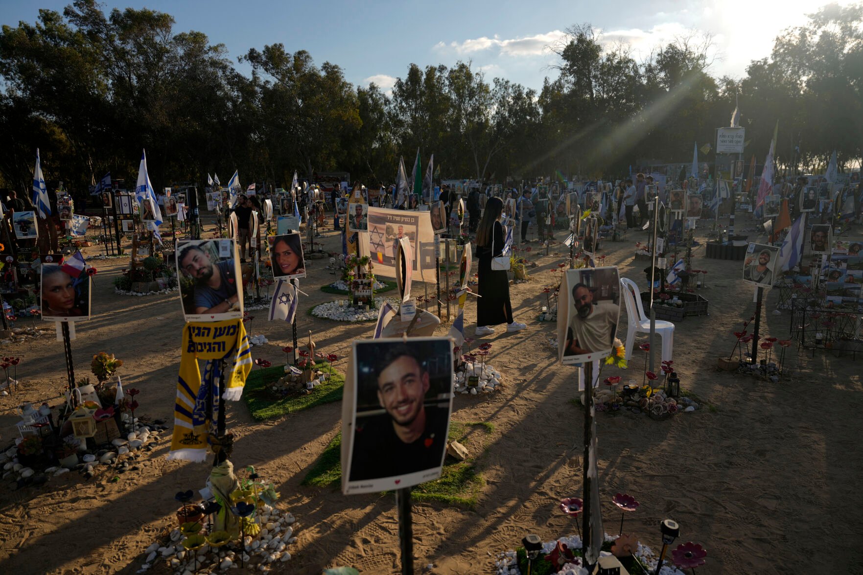 <p>FILE - People visit the site of the Nova music festival, where hundreds of revelers were killed and abducted by Hamas and taken into Gaza, on the one-year anniversary of the attack near Kibbutz Reim, southern Israel, on Oct. 7, 2024. (AP Photo/Ariel Schalit, File)</p>