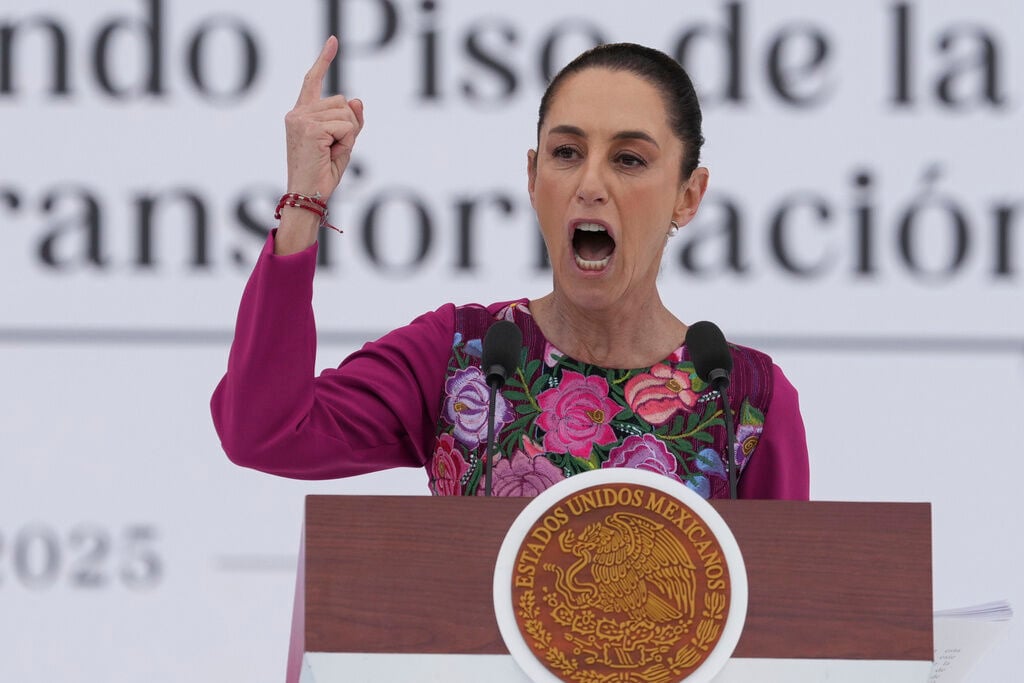 <p>FILE - President Claudia Sheinbaum speaks to the crowd during an event marking her first 100 days in office, at the Zócalo, Mexico City's main square, in Mexico City, Sunday, Jan. 12, 2025. (AP Photo/Fernando Llano, File)</p>