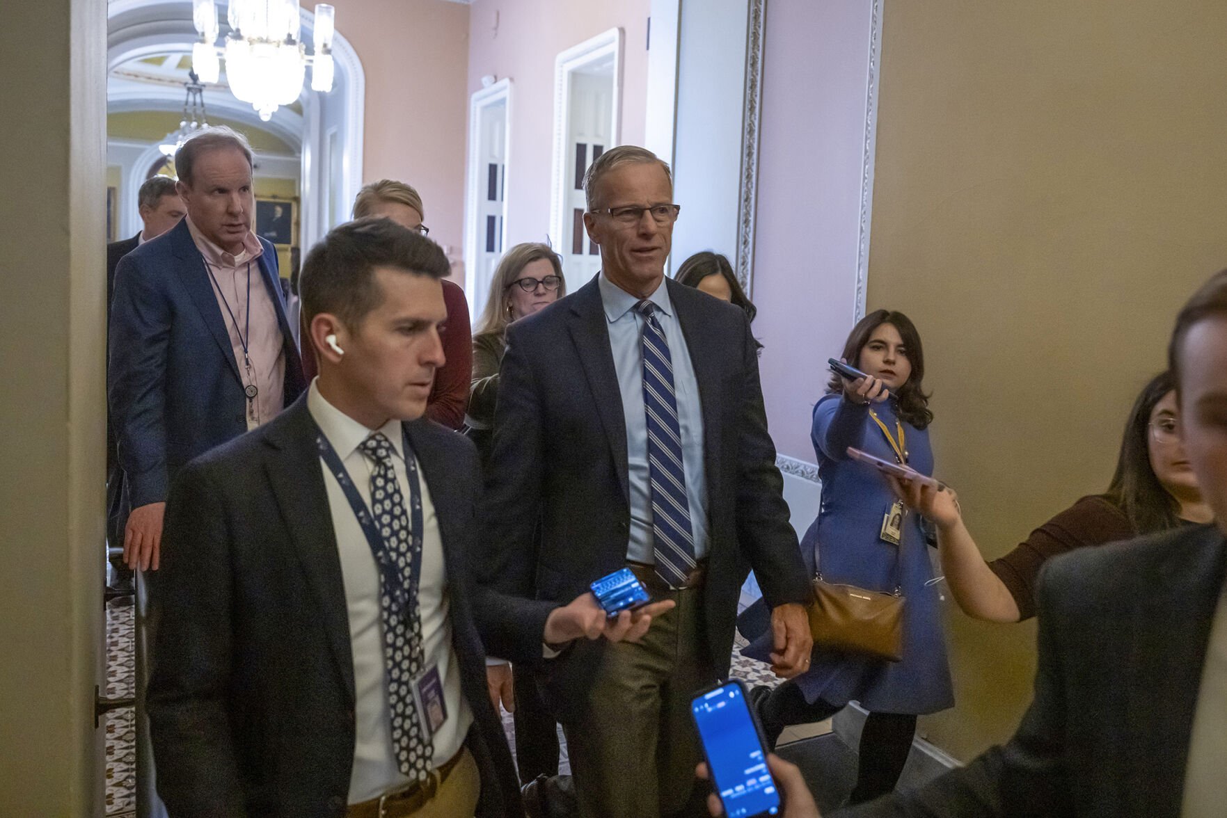 <p>Senate Majority Leader Sen. John Thune, R-S.D., walks from the Senate chamber Friday as the Senate works to pass a Republican spending bill at the Capitol in Washington.</p>