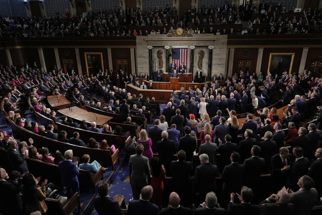 <p>Republicans stand as Democrats sit as President Donald Trump addresses a joint session of Congress in the House chamber at the U.S. Capitol in Washington, Tuesday, March 4, 2025. (AP Photo/Julia Demaree Nikhinson)</p>