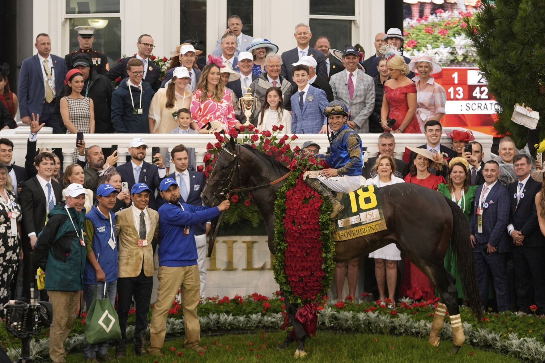 <p>Jockey Junior Alvarado celebrates after riding Sovereignty to victory in the 151st running of the Kentucky Derby, on Saturday, at Churchill Downs.</p>