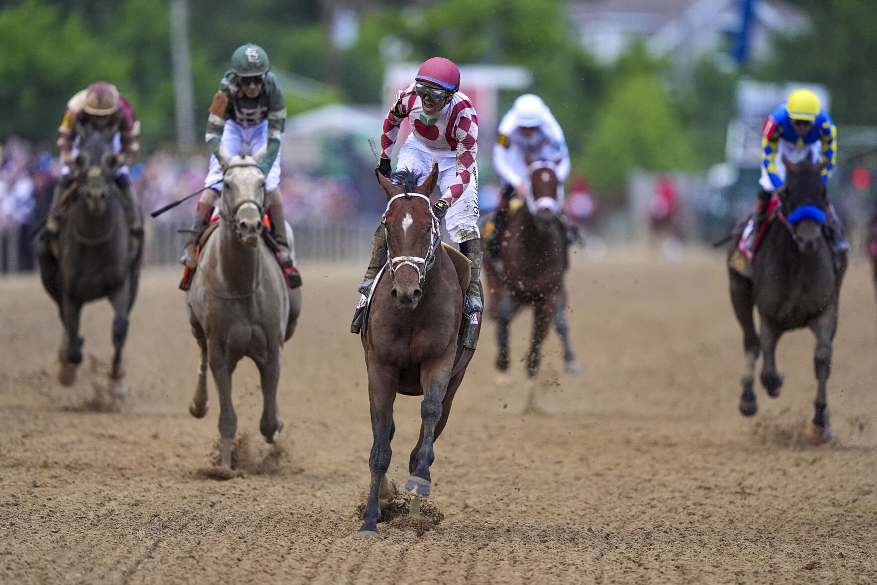<p>Umberto Rispoli, atop Journalism, reacts Saturday after winning the the 150th running of the Preakness Stakes at Pimlico Race Course in Baltimore.</p>