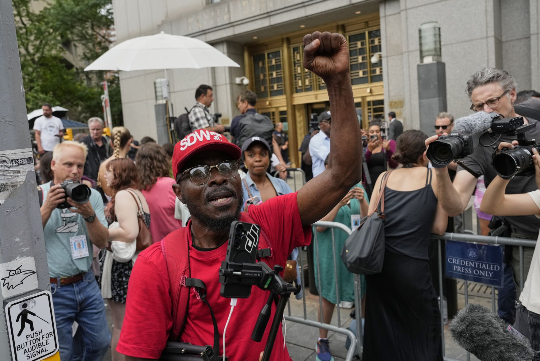 <p>A supporter of Sean "Diddy" Combs, reacts outside Manhattan federal court after Combs' was convicted of a prostitution-related offense but acquitted on the most serious charges at his New York trial, July 2, in New York.</p>