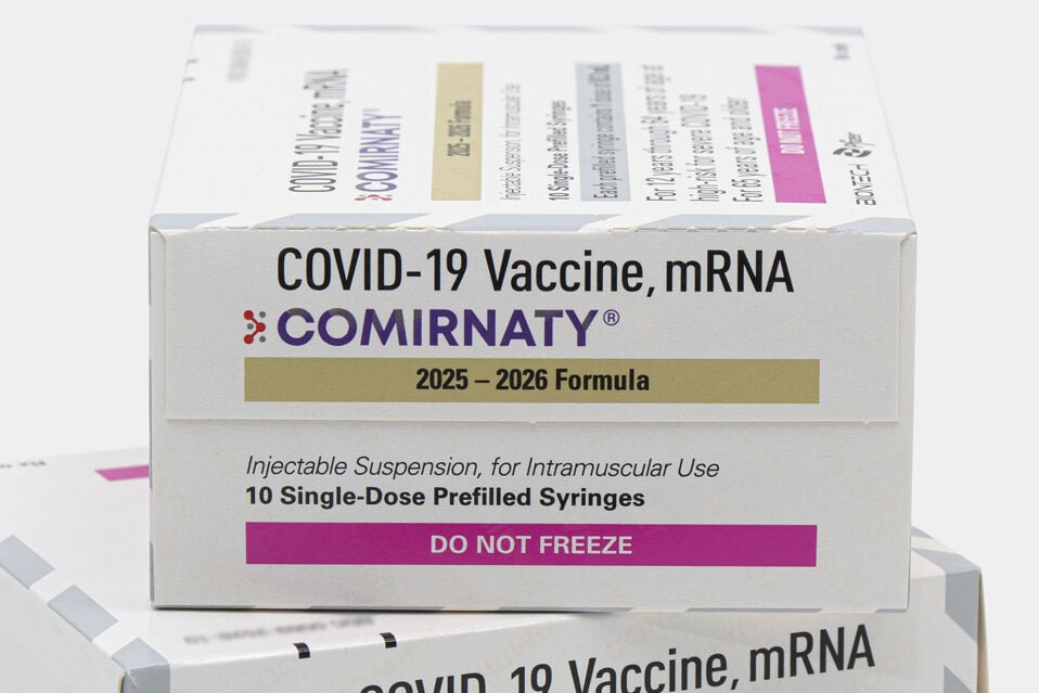 <p>This photo provided by Pfizer in August 2025 shows boxes for the updated COVID-19 vaccine Comirnaty. (Pfizer via AP)</p>