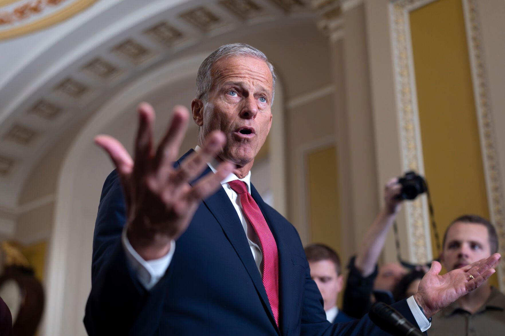 <p>Senate Majority Leader John Thune, R-S.D., gestures Tuesday while speaking with reporters at the Capitol in Washington as the government lurches toward a shutdown.</p>