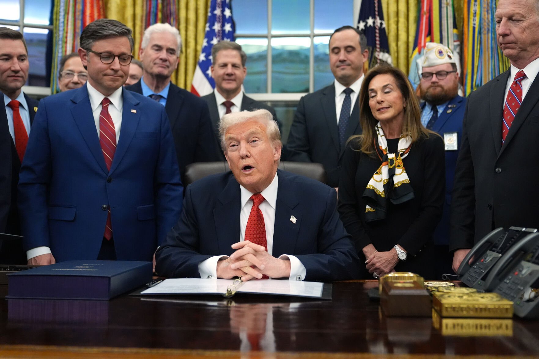 <p>President Donald Trump speaks Wednesday in the Oval Office of the White House in Washington before signing the funding bill to reopen the government.</p>