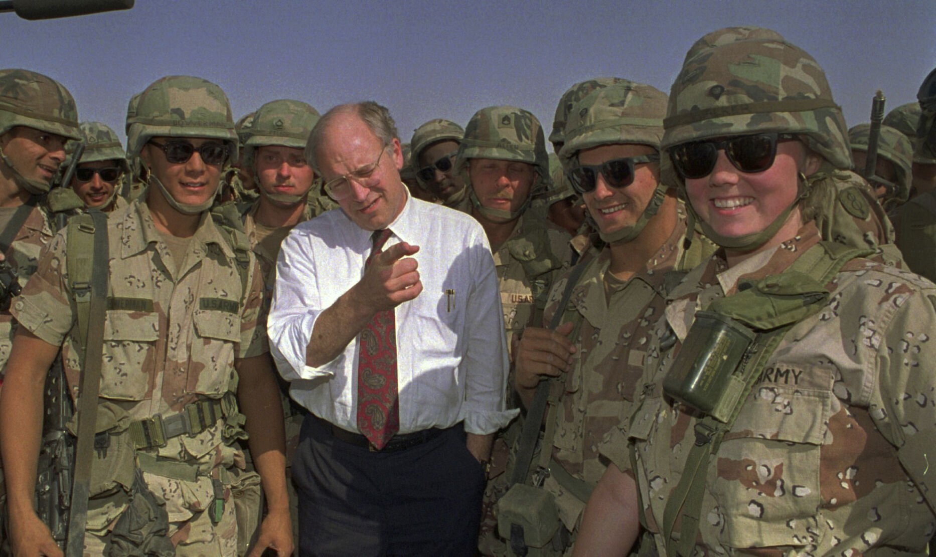 <p>Defense Secretary Dick Cheney poses with some of the U.S. Army troops stationed in southern Iraq in this May 7, 1991 file photo.</p>