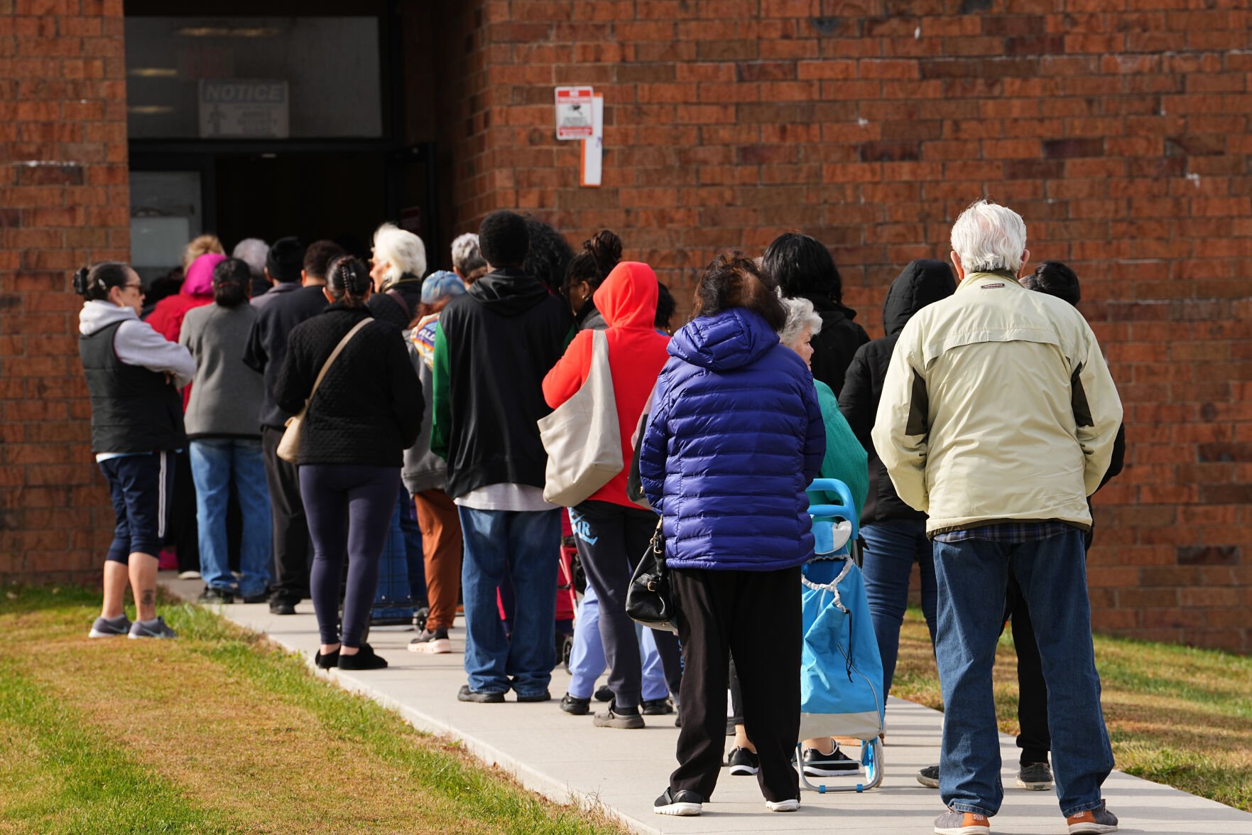 <p>People wait in line during an emergency food distribution Friday at The Jewish Federation of Greater Philadelphia's Mitzvah Food Program in Philadelphia.</p>