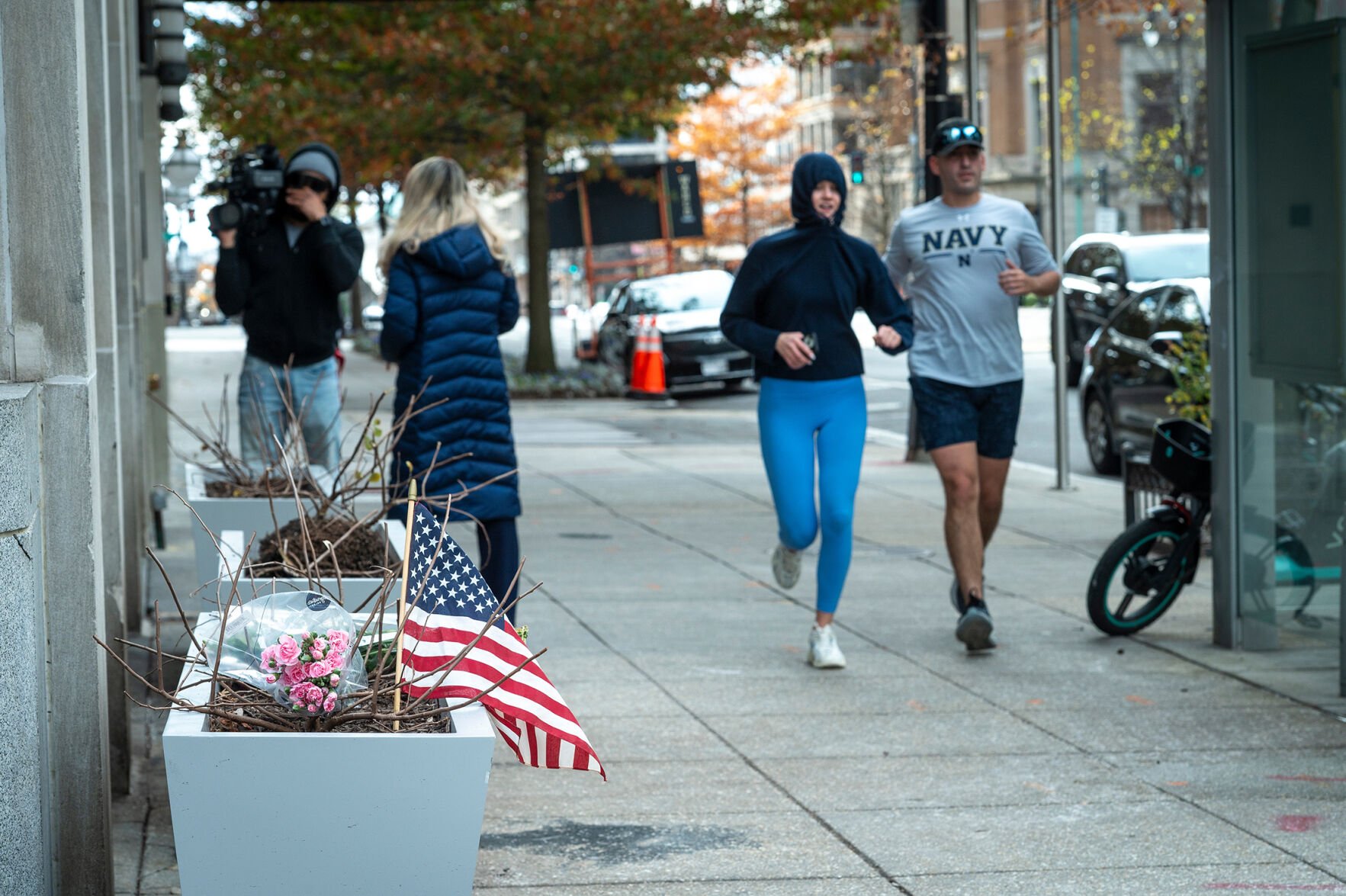 <p>Flowers and an American flag are seen at the scene Thursday, a day after two National Guard soldiers were shot near the White House in Washington. </p>