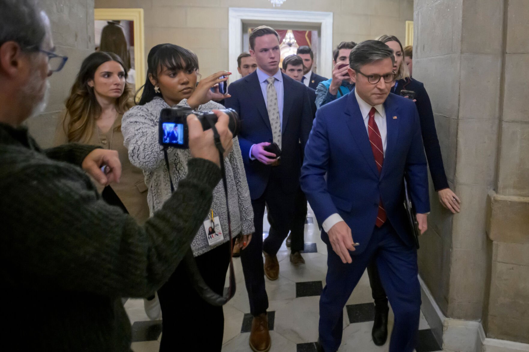 <p>Speaker of the House Mike Johnson, R-La., talks with reporters Wednesday as he walks from the House chambers at the U.S. Capitol in Washington.</p>