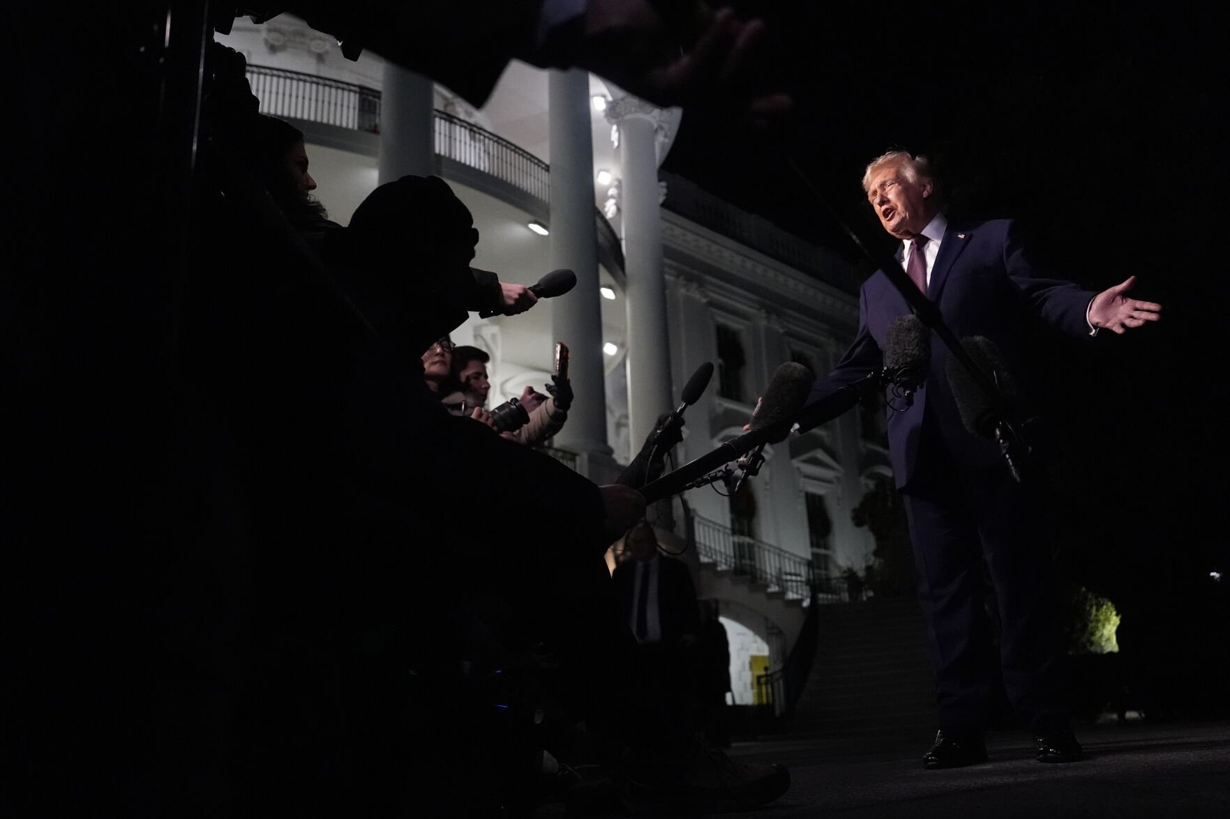 <p>President Donald Trump talks to the media as he walks to Marine One from the White House, Friday, Dec. 19, 2025, in Washington. (AP Photo/Julia Demaree Nikhinson)</p>