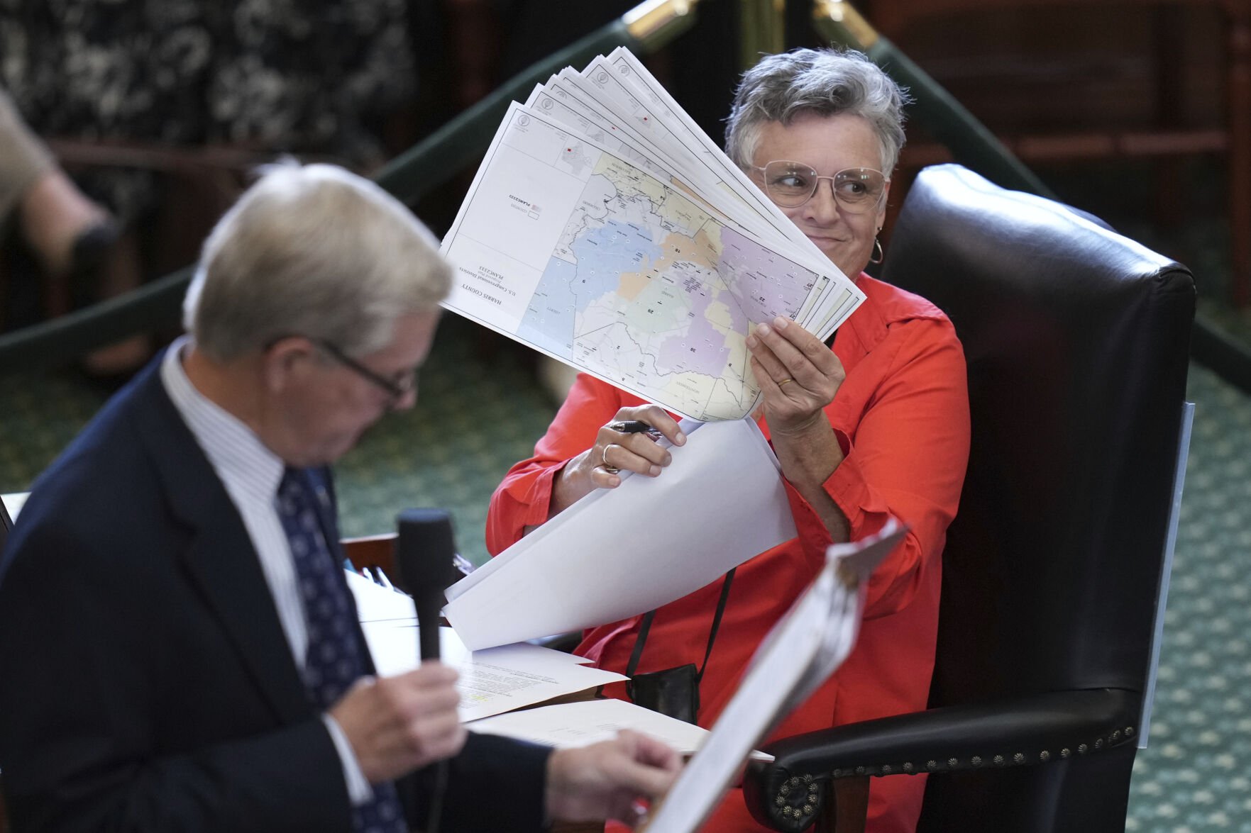 <p>Texas state Sen. Sarah Eckhardt, D-Austin, right, listens as Sen. Phil King, R-Weatherford, speaks in favor of a bill Aug. 22 before a vote on a redrawn U.S. congressional map during a special session in the Senate Chamber at the Texas Capitol in Austin.</p>