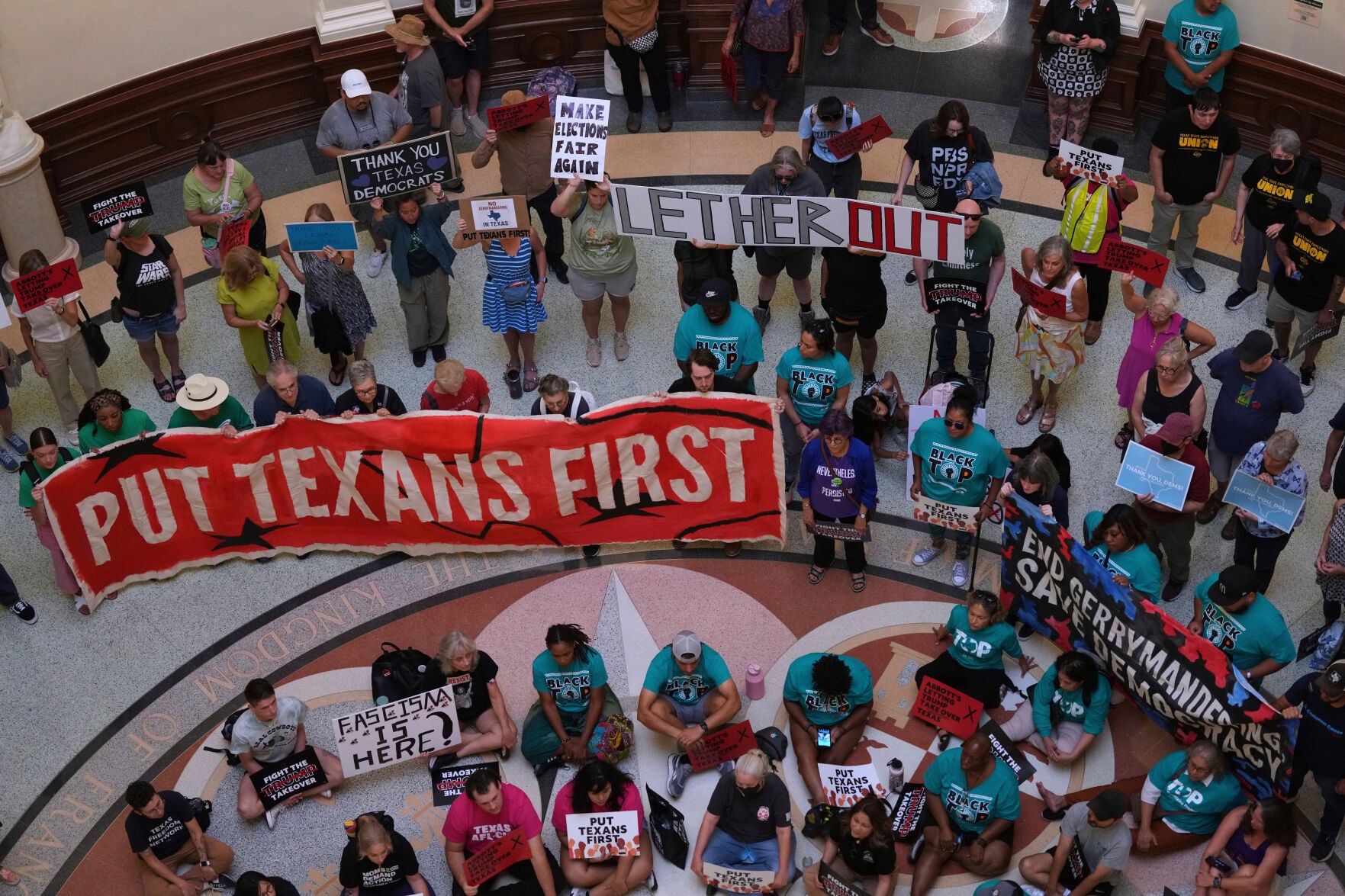 <p>Protesters gather Aug. 20 in the rotunda outside the House Chamber at the Texas Capitol in Austin as lawmakers debate a redrawn U.S. congressional map during a special session.</p>