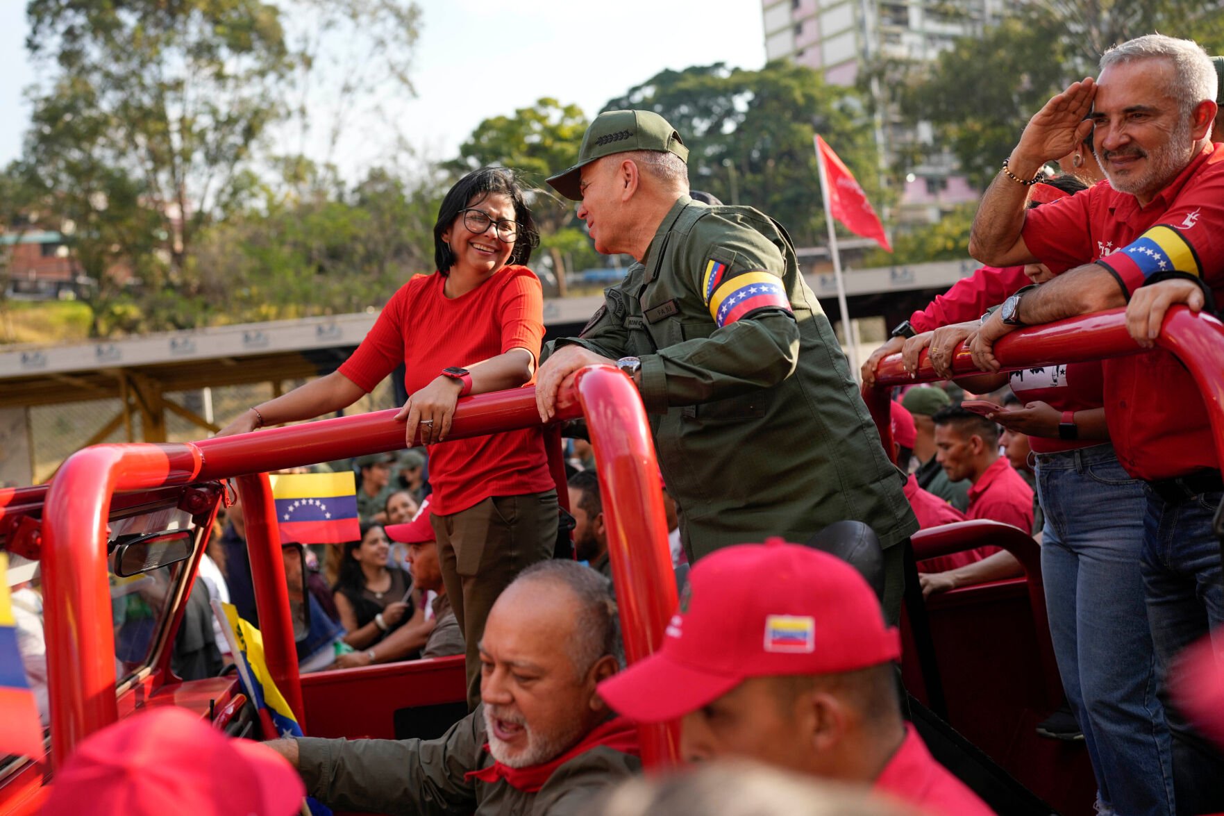 <p>FILE - Vice President Delcy Rodriguez, left, smiles at Venezuelan Defense Minister Padrino Lopez, as they take the route that the body of late President Hugo Chavez was transported to his final resting place, during the activities marking the 10th anniversary of Chavez's death, in Caracas, Venezuela, March 15, 2023. (AP Photo/Matias Delacroix, File)</p>