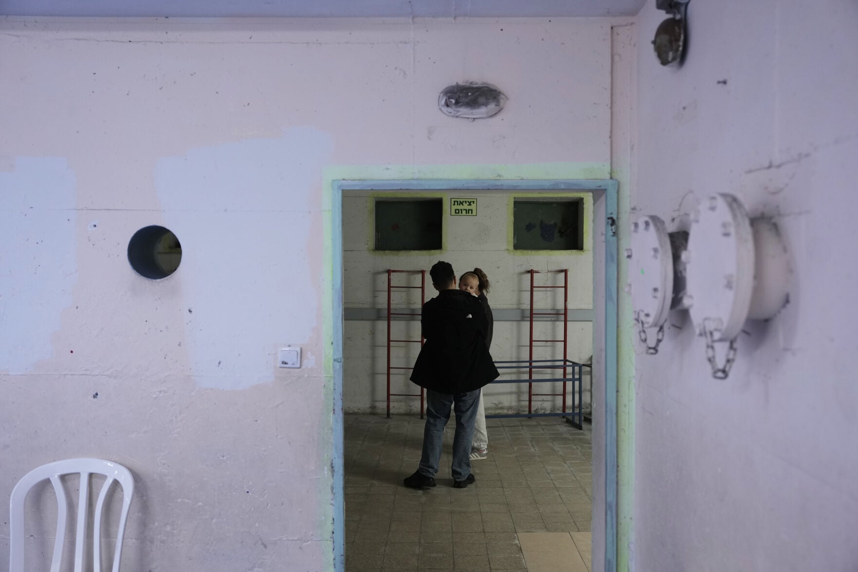 <p>Civilians stay in a shelter Saturday in Ramat Gan, Israel, after alarms announced Israel launched an attack on Iran.</p>