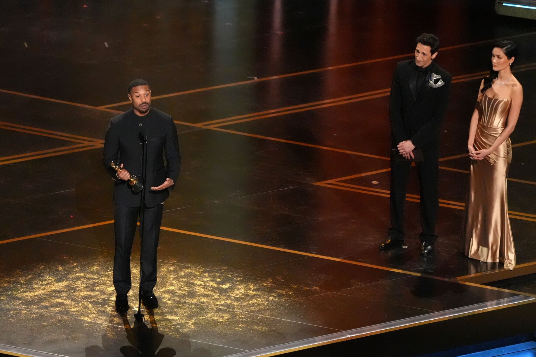 <p>Michael B. Jordan accepts the award for actor in a leading role for "Sinners" during the Oscars on Sunday, March 15, 2026, at the Dolby Theatre in Los Angeles. Adrien Brody looks on from right.(AP Photo/Chris Pizzello)</p>