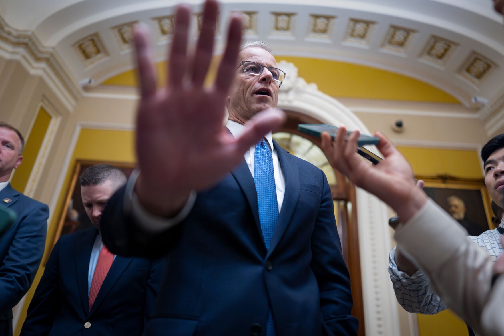 <p>Senate Majority Leader John Thune, R-S.D., gestures as he speaks to reporters outside the chamber after passing a a measure by unanimous consent that would fund most of the Department of Homeland Security if the House agrees, at the Capitol in Washington, Thursday, April 2, 2026. (AP Photo/J. Scott Applewhite)</p>