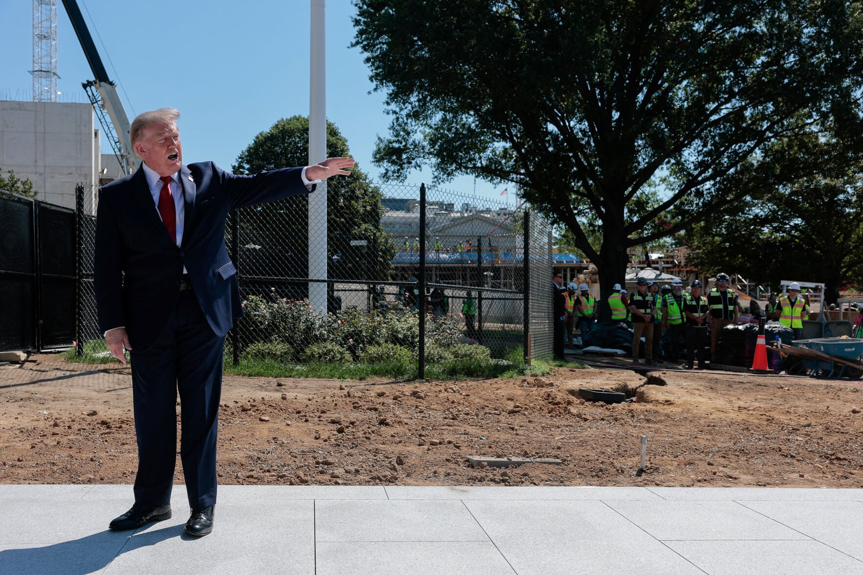 <p>President Donald Trump speaks to reporters Wednesday about the helipad under constructed on the South Lawn at the White House in Washington.</p>