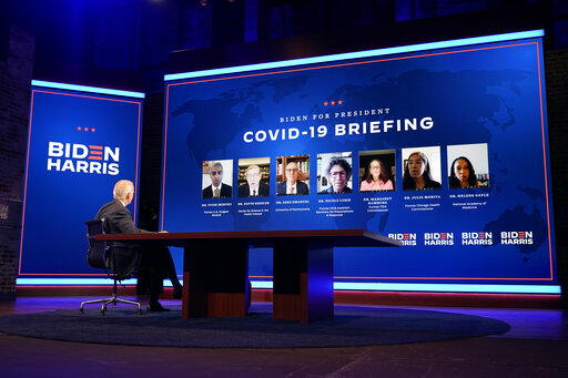 The Latest: Health Experts Brief Biden On Slowing Virus