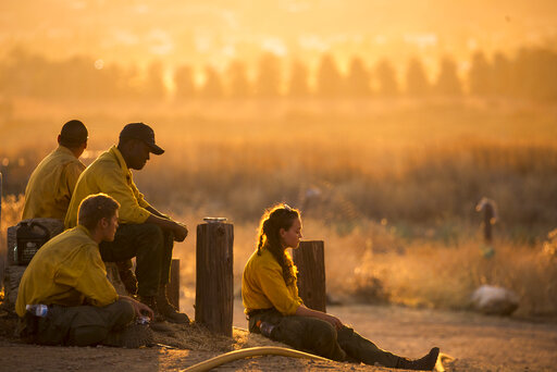 Firefighters Battle Exhaustion Along With Wildfire Flames