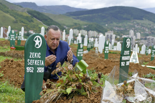Bosnia: Unnerved By Virus Denial, Survivors Mourn Their Dead