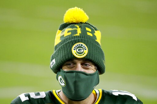 The Latest: Packers To Keep Limited Attendance At Home Games