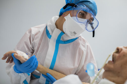 Ap Photos: Madrid Hospital Staff Learn To Cope With Virus