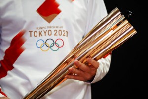 Tokyo Olympic Torch Relay: Masks, Quiet Cheering And Caution