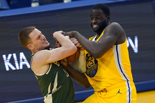 Curry, Warriors Use Furious Finish To Hold Off Bucks 122 121