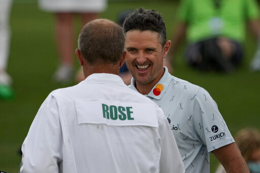 The Latest: Rose Breezes To A 65 On Tough Day At Augusta