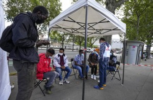 Aid Group Vaccinates Migrants As France Expands Virus Pass