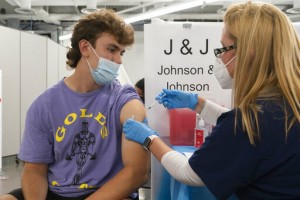 To Get Shots In Arms, Governments Turn To Money In Pockets