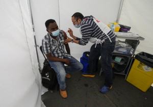 Aid Group Vaccinates Migrants As France Expands Virus Pass