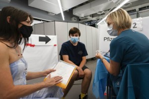 To Get Shots In Arms, Governments Turn To Money In Pockets