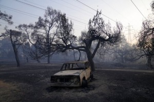 Firefighting Planes Resume Flights Over Fire North Of Athens