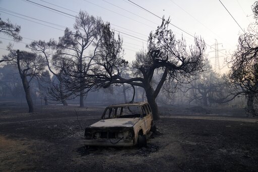 Firefighting Planes Resume Flights Over Fire North Of Athens