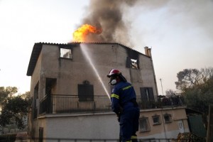 Firefighting Planes Resume Flights Over Fire North Of Athens